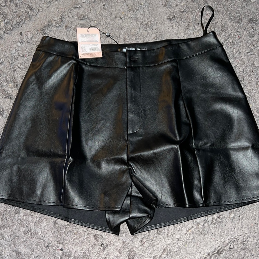 Black faux leather shorts.